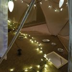 Mini light strings in a cardboard tent